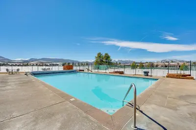 a swimming pool with a view of the water at Inviting and Cozy Fraser Condo Steps to Ski Shuttle in Fraser