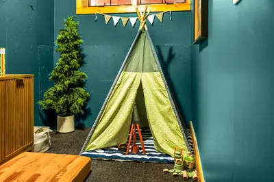 a childs play room with a teepee tent at Royal Elk Lodge Hot Tub Sauna Theatre Speakeasy in Bailey