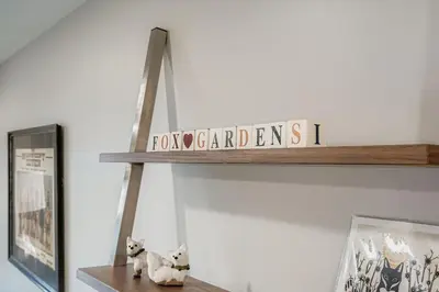 a wooden shelf with a sign that says ford adventurersii at FoxGardens Incredible Lake & Mtn View Private Secure in Lakewood