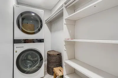 a laundry room with a washer and dryer at FoxGardens Incredible Lake & Mtn View Private Secure in Lakewood
