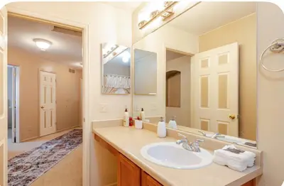 a bathroom with a sink and a large mirror at Freesan in DEN