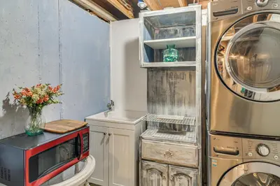 a utility room with a washer and dryer at Stunning Snowcapped Mtn Views! Evergreen Home in Evergreen