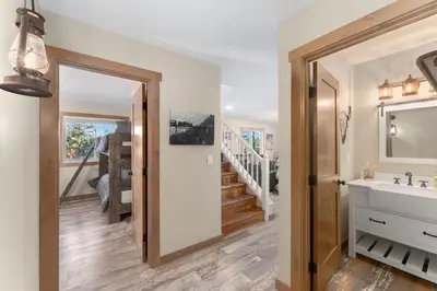 a bathroom with a sink and a mirror at The Pine Getaway on 60 Acres with Hot Tub in Pine