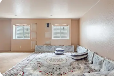 a living room with a couch and a rug at Iman in DEN