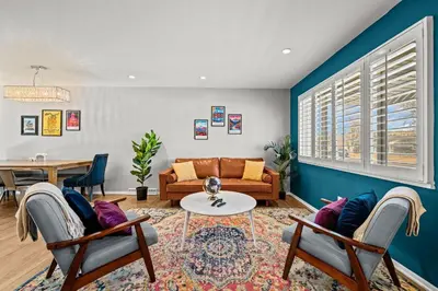 a living room with a couch and a table at Cherry Creek Jasmine Retreat in Denver CO in Denver