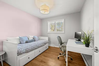 a bedroom with a bed and a desk with a computer at Cherry Creek Jasmine Retreat in Denver CO in Denver