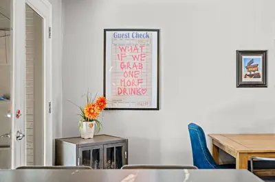 a dining room with a table and a picture on the wall at Cherry Creek Jasmine Retreat in Denver CO in Denver