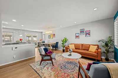 a living room with a couch and a table at Cherry Creek Jasmine Retreat in Denver CO in Denver