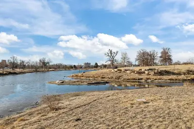 a view of a river with trees in the background at Cherry Creek Jasmine Retreat in Denver CO in Denver