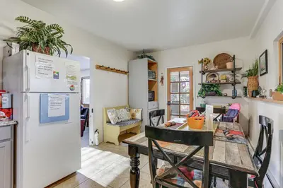 a kitchen with a table and a refrigerator at Pet-Friendly Pine Home Near Hiking and Fishing! in Pine