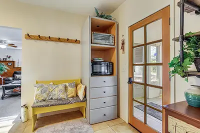 a living room with a couch and a microwave at Pet-Friendly Pine Home Near Hiking and Fishing! in Pine