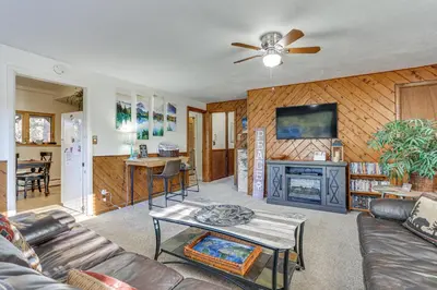 a living room with a couch and a table at Pet-Friendly Pine Home Near Hiking and Fishing! in Pine