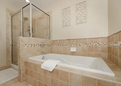 a bathroom with a bath tub and a shower at Base Camp 402 condo in Granby
