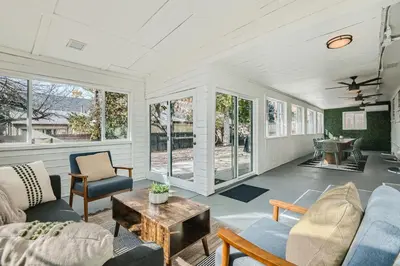 a living room with couches and a table at Private Home - Hot Tub, Game Room, Fire Pit, Fenced Yard in Westminster