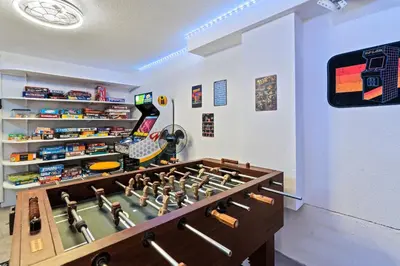 a game room with a large wooden chess board at Private Home - Hot Tub, Game Room, Fire Pit, Fenced Yard in Westminster