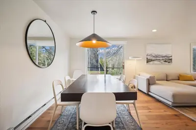 a dining room with a table and a couch at Stay at Frisco Creekside Retreat! Located in a great location in Frisco