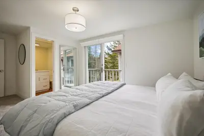 a large white bed in a room with a window at Stay at Frisco Creekside Retreat! Located in a great location in Frisco