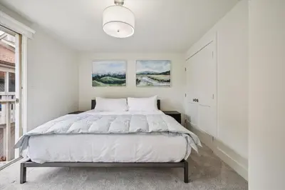 a white bedroom with a bed and a window at Stay at Frisco Creekside Retreat! Located in a great location in Frisco
