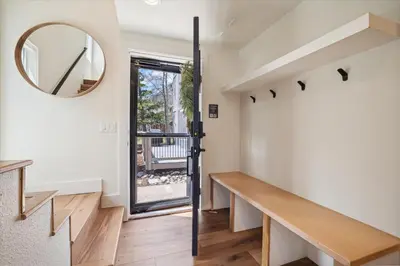 a staircase in a house with a mirror on the wall at Stay at Frisco Creekside Retreat! Located in a great location in Frisco