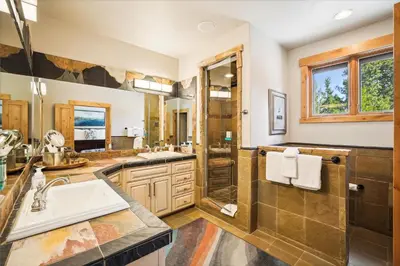 a bathroom with a sink and a shower at Experience Frisco Fling, a spacious house in the heart of Frisco with a hot tub and wooded views in Frisco