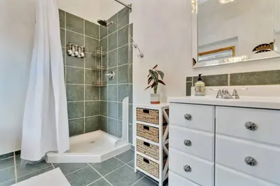 a bathroom with a shower and a sink at Family Mountain Getaway w Hot Tub and Amazing Views! Close to Hiking & Skiing in Idaho Springs