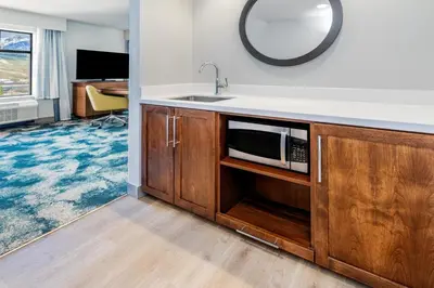 a kitchen with a sink and a microwave at Hampton Inn & Suites Silverthorne in Silverthorne
