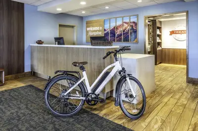 a bike is parked next to a reception desk at Hampton Inn & Suites Silverthorne in Silverthorne