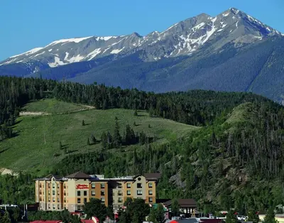 a large building in front of a mountain at Hampton Inn & Suites Silverthorne in Silverthorne