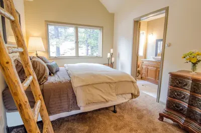 a bedroom with a ladder bed and a window at The Silver Lake Lodge - Adults Only in Idaho Springs