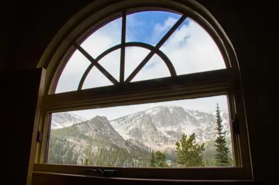 a window with a view of a mountain at The Silver Lake Lodge - Adults Only in Idaho Springs