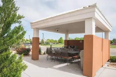 a pavilion with tables and chairs on a patio at Candlewood Suites Fort Collins by IHG in Fort Collins