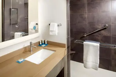 a bathroom with a sink and a shower at Hyatt House Denver Lakewood Belmar in Lakewood