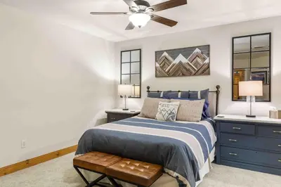 a bedroom with a bed and a ceiling fan at Mount Victoria Lodge #D in Frisco