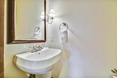 a bathroom with a white sink and a mirror at Marina Park 14C in Frisco