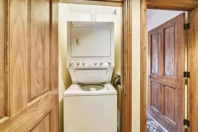 a washer and dryer in a room with a door at Marina Park 14C in Frisco