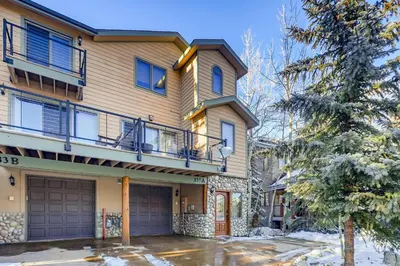 a house with a balcony and a garage at Streamside 333A in Frisco