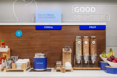 a grocery store with food items on a shelf at Holiday Inn Express & Suites Ft Collins by IHG in Fort Collins