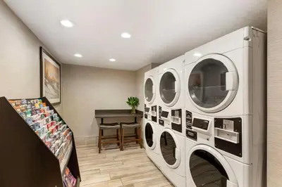 a laundry room with a washer and dryer at Best Western Greeley in Greeley