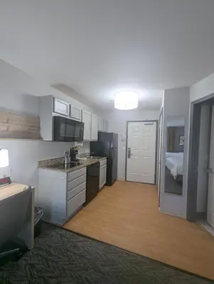 a kitchen with a sink and a counter top at Candlewood Suites Loveland by IHG in Loveland