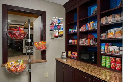 a food pantry with shelves of food and a mirror at Hampton Inn & Suites Denver/Highlands Ranch in Littleton