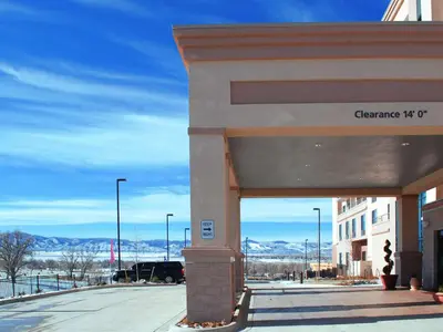 a building with a sign for the entrance to a building at Hampton Inn & Suites Denver/Highlands Ranch in Littleton