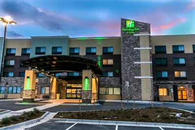 a hotel building with a sign in front of it at Holiday Inn & Suites Denver Tech Center-Centennial by IHG in Centennial