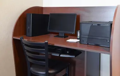 a desk with a computer monitor and a printer at My Place Hotel-Loveland, CO in Loveland