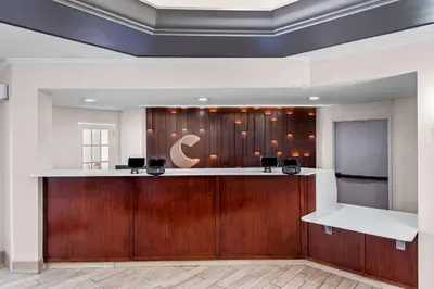 a lobby with a reception desk in a building at Comfort Suites Denver North - Westminster in Westminster