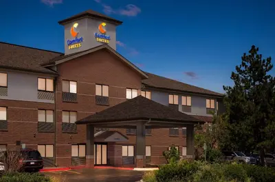 a front view of a hotel with a building at Comfort Suites Denver North - Westminster in Westminster