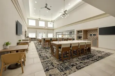 a large dining room with a large table and chairs at Homewood Suites by Hilton Denver West - Lakewood in Lakewood
