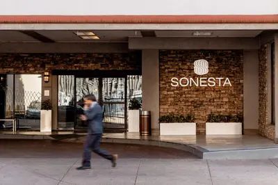 a man walking in front of a store at Sonesta Denver Downtown in Denver