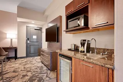 a kitchen with a sink and a counter top at DoubleTree by Hilton Denver International Airport, CO in Denver