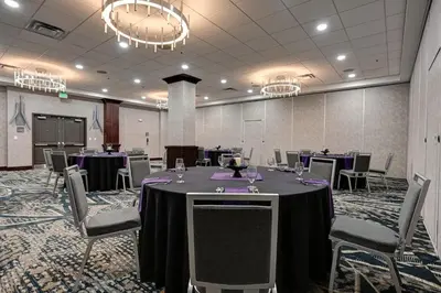 a conference room with a table and chairs in it at DoubleTree by Hilton Denver International Airport, CO in Denver