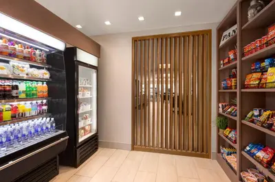 a store aisle with a large door in a store at Holiday Inn Express & Suites Denver Airport by IHG in Denver